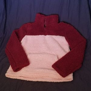 Fluffy pink and maroon hoodie.